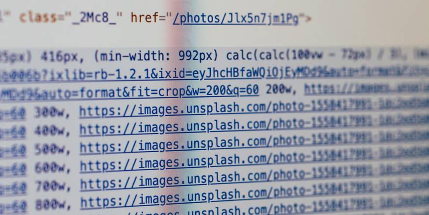 Illustration of a user browsing an alphabetical HTML sitemap on a laptop