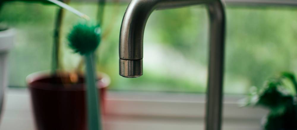 Tenant documents a leaking kitchen faucet before requesting repairs in a Michigan rental