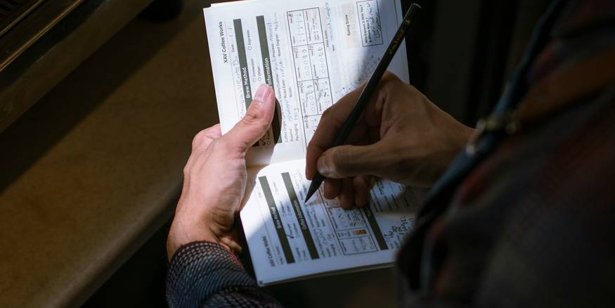 A Michigan renter reviews eviction court documents at a district-court bench