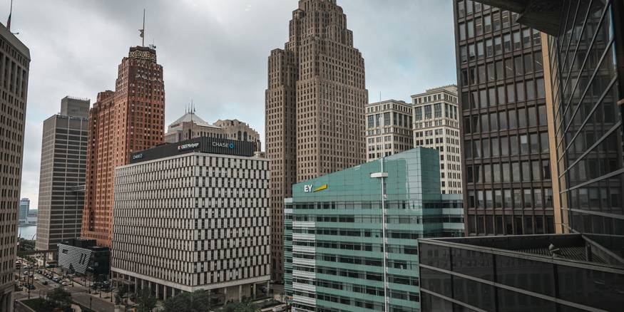 Michigan landlord reviews rental paperwork in a Detroit office