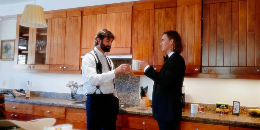 Two renters reviewing a lease document at a kitchen table, symbolizing Michigan tenant rights