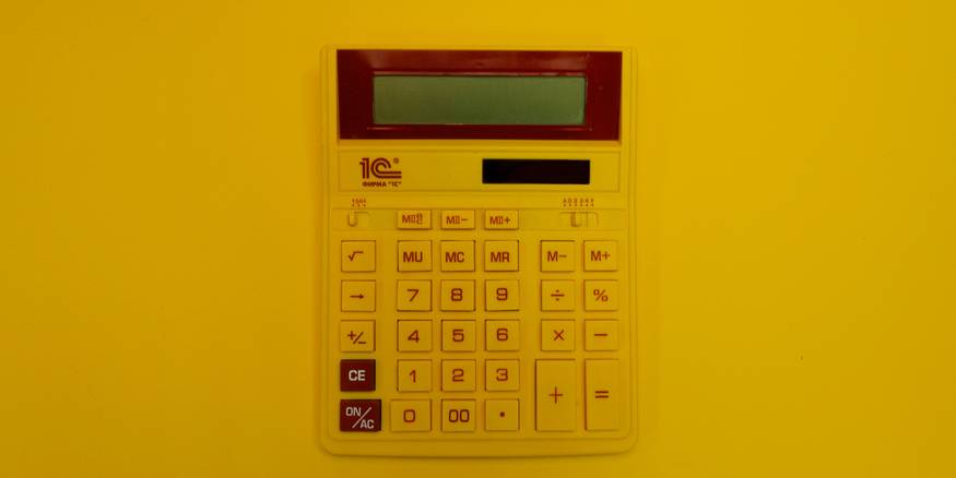 Tenant uses a calculator to work out prorated rent costs