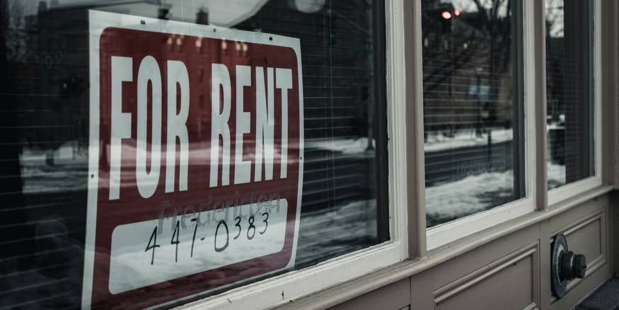 Tenant and landlord discuss rent increase notice in Michigan apartment