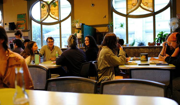 Tenant discusses early lease termination options with Michigan landlord in café setting