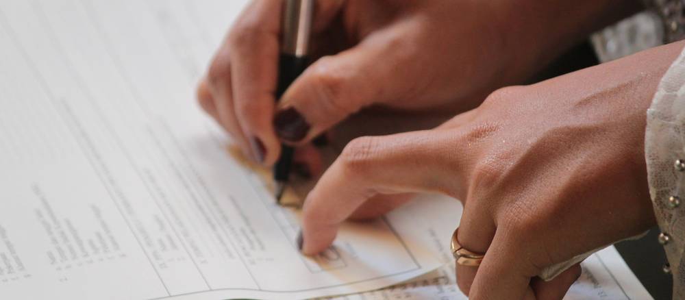 Michigan renter carefully reviews a security-deposit disclosure form before signing the lease