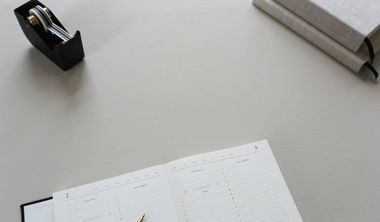 Tenant drafting late-fee dispute letter at desk